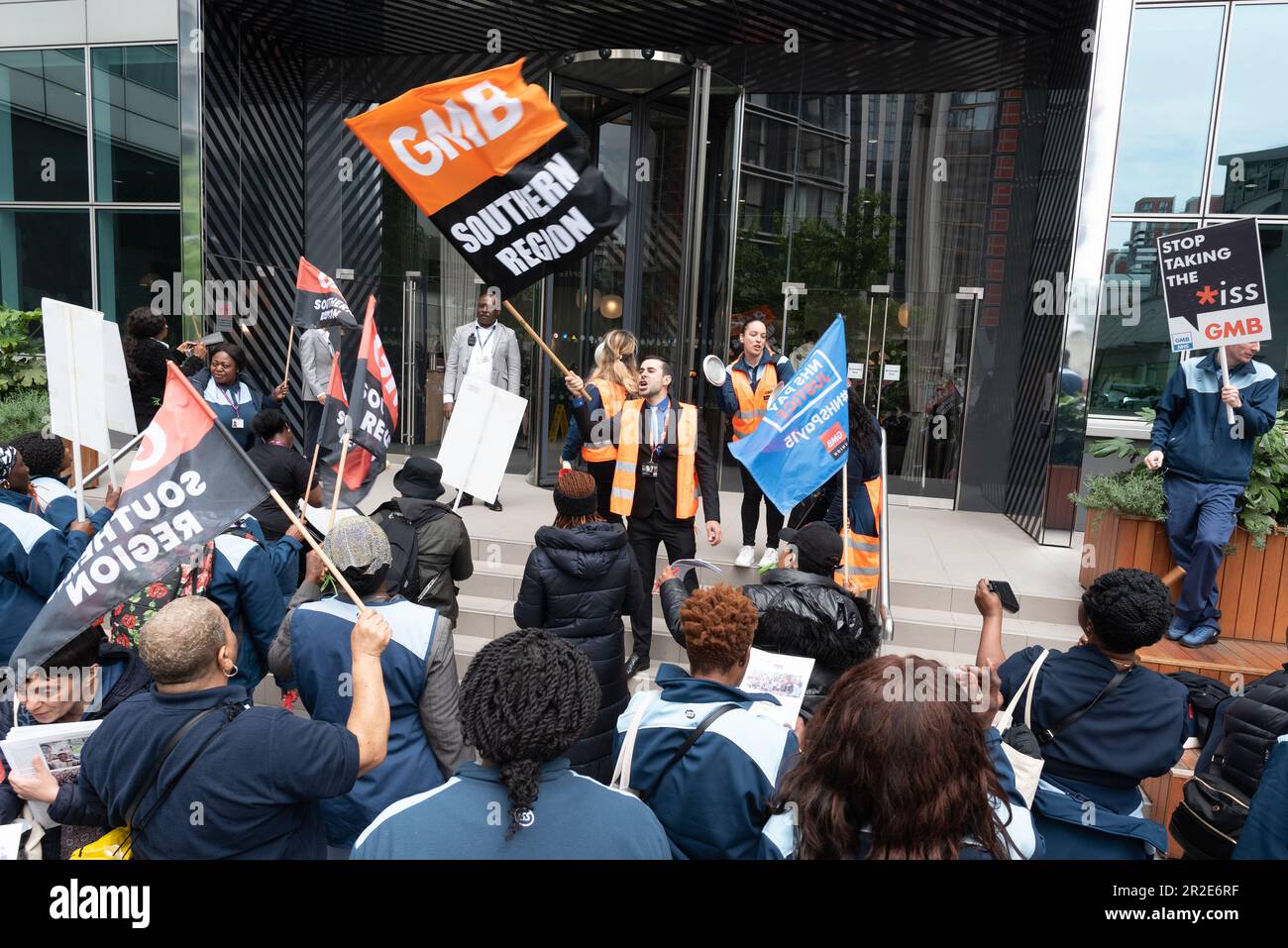 London, UK. 19 May, 2023. Striking caterers and domestic staff who work at South London & Maudsley NHS Trust protest outside the Docklands HQ of their employer, outsourcing giant ISS, in a dispute over poor wages and conditions. The workers, members of GMB, the NHS union, are engaged in a four day strike. Credit: Ron Fassbender/Alamy Live News Stock Photo