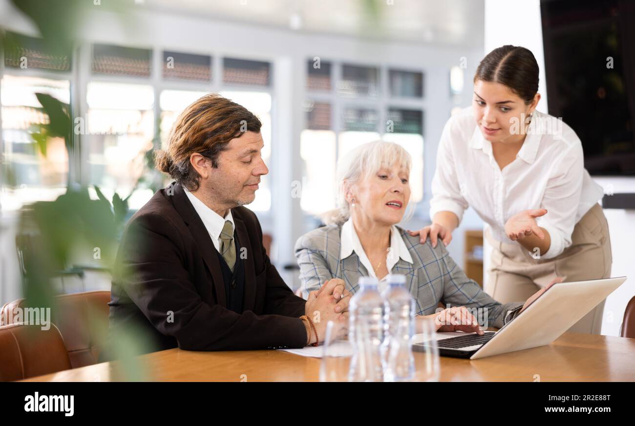 Business people developing strategy for teamwork at table in office ...