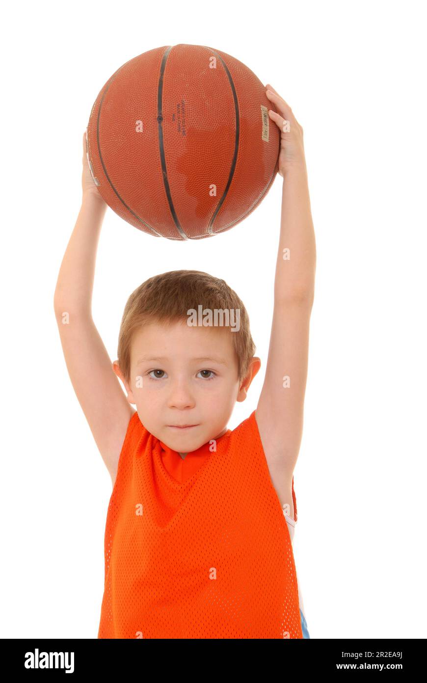 Young boy playing with a basketball isolated on white Stock Photo - Alamy