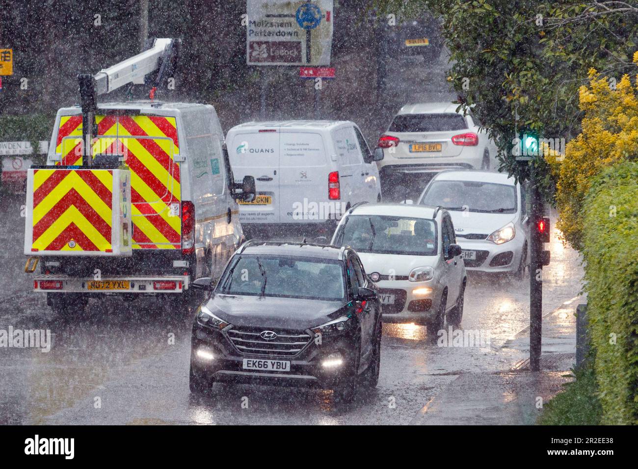 Chippenham, Wiltshire, UK. 19th May, 2023. Drivers are pictured braving heavy rain in Chippenham as heavy rain showers make their way across Southern England. Credit: Lynchpics/Alamy Live News Stock Photo