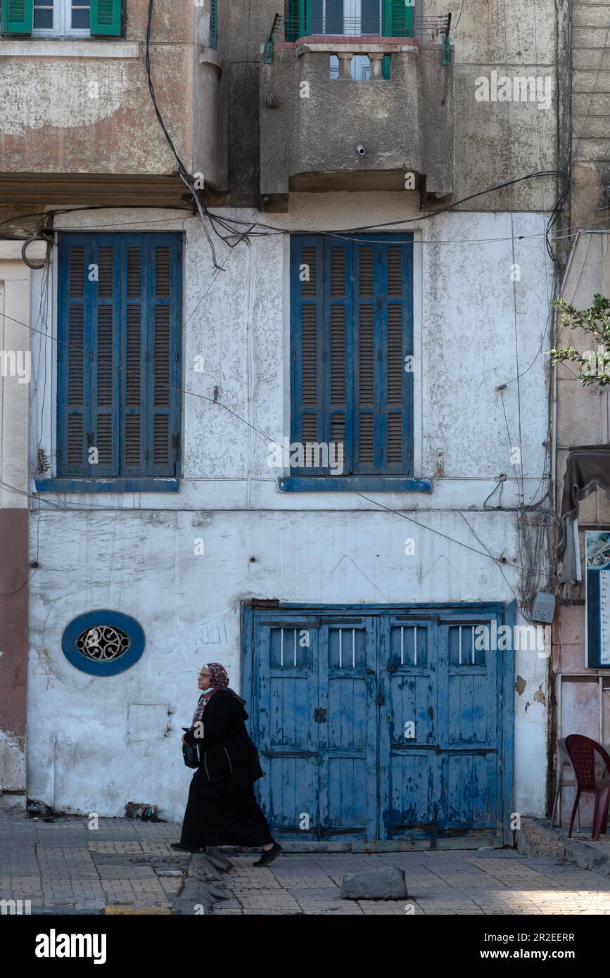 Alexandria, Egypt. 3rd Dec, 2022. Blue painted doors and windows of faded traditional architecture along the Corniche of the north Egyptian Delta city of Alexandria, Egypt. (Credit Image: © John Wreford/SOPA Images via ZUMA Press Wire) EDITORIAL USAGE ONLY! Not for Commercial USAGE! Stock Photo