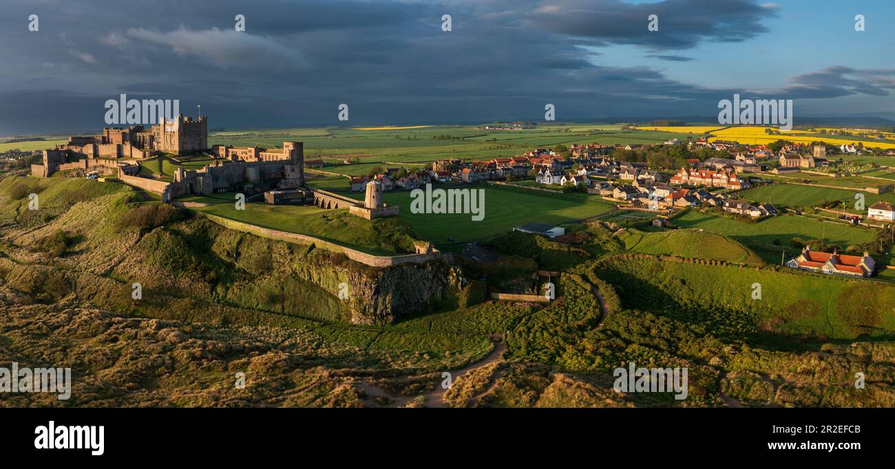 Early morning aerial view of the iconic Bamburgh Castle on the Northumberland coast. England, UK Stock Photo