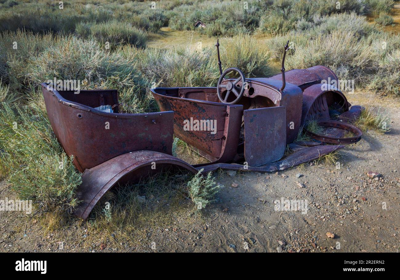 Rusted classic car in the ghost town of Bodie, an old gold mining town ...