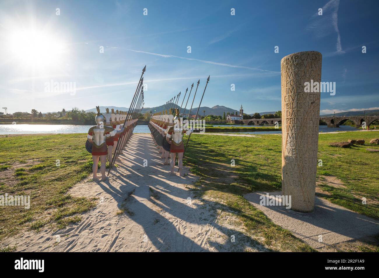 Roman Figures And Memorial Column At Ponte De Lima Bridge By Day roman-figures-and-memorial-column-at-ponte-de-lima-bridge-by-day