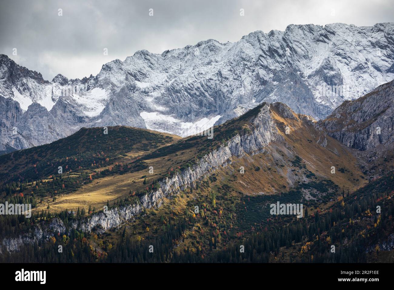 View from the Kreuzeck into the Reintal and snow-covered mountains near Garmisch-Partenkirchen in autumn, Bavaria Stock Photo