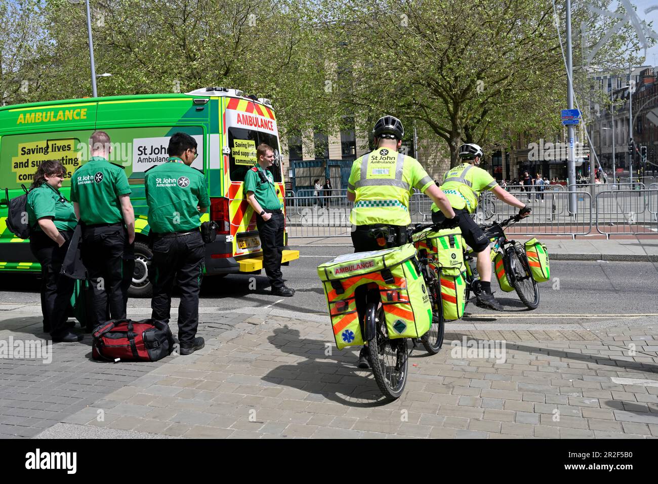St John Ambulance volunteers first responders on bikes at public event Bristol city centre Stock Photo