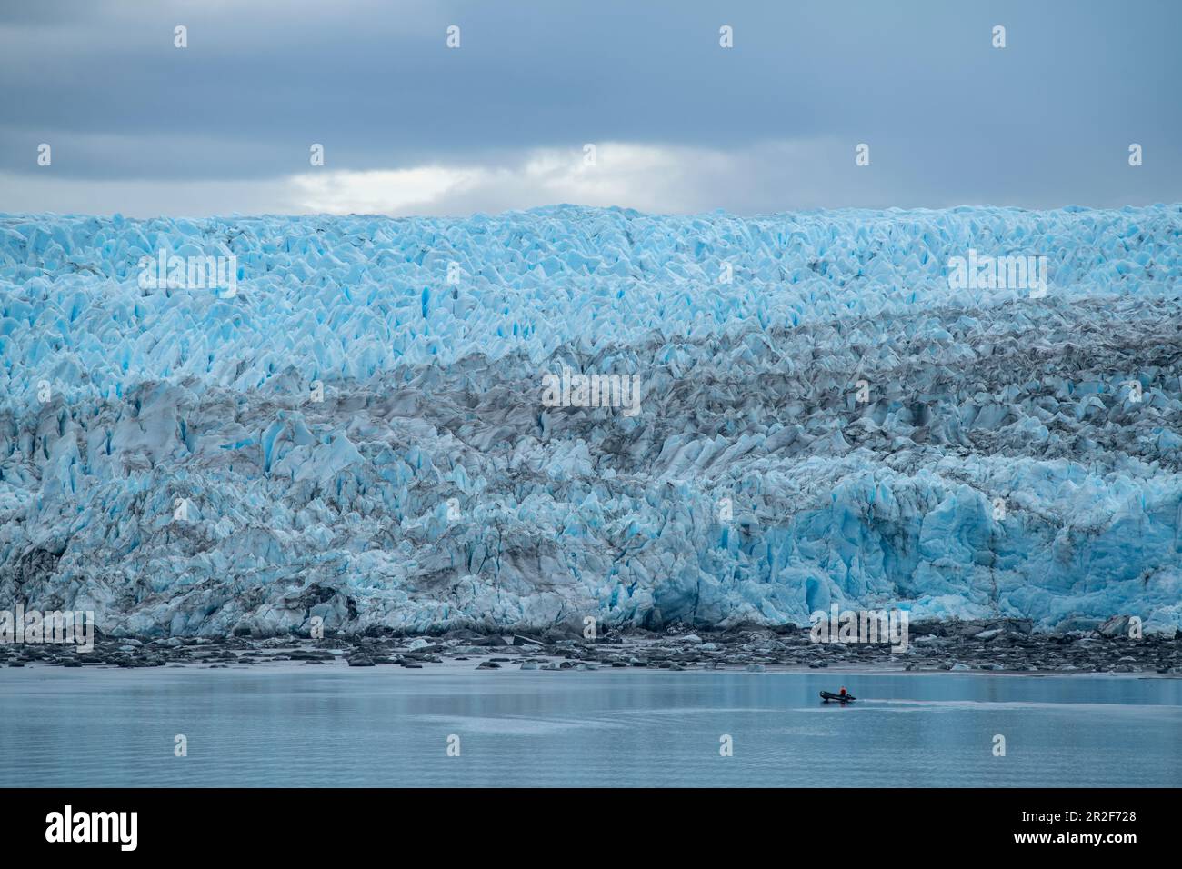 A Zodiac inflatable boat passes the front edge of the massive Pio XI ...