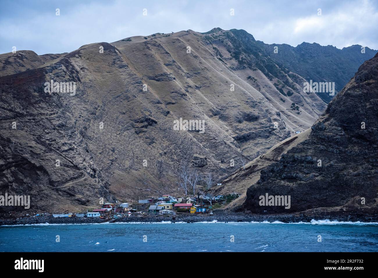 Approaching the former penal colony of Alejandro Selkirk Island (formerly Mas Afuera - Farther Out) and the settlement between two high ridges, Alejan Stock Photo
