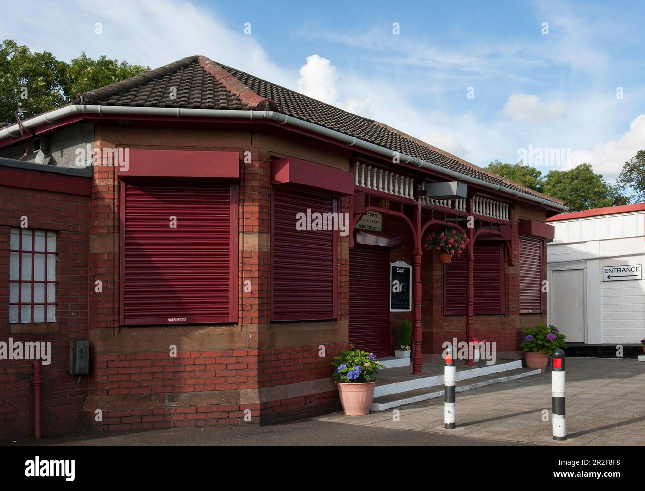 Flowers hang in the Victorian pavilion of the Abercorn lawn bowling Green in Paisley, Scotland Stock Photo
