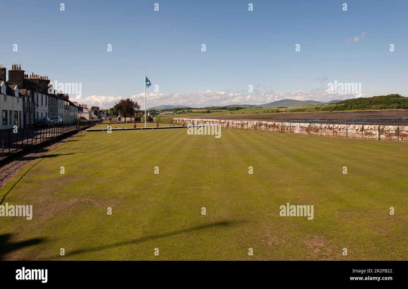 A St Andrews flag flies on Garlieston lawn bowling green beside the sea in Dumfries and Galloway Scotland Stock Photo