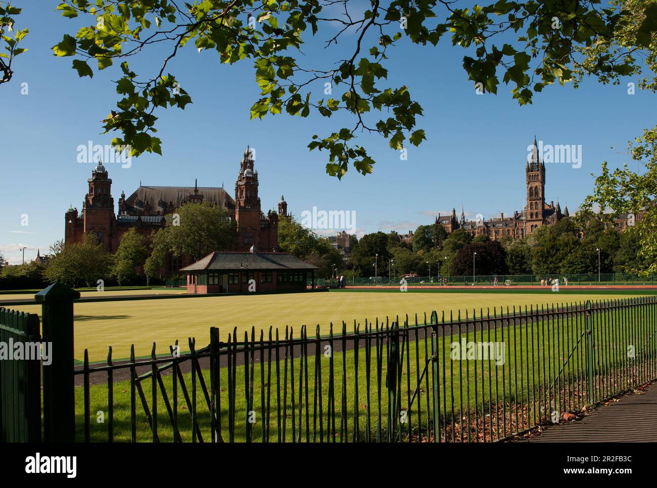 The pavilion of Kelvingrove lawn bowling green in front of Kelvingrove Art Gallery and Museum and the University of Glasgow in Glasgow, Scotland, UK Stock Photo
