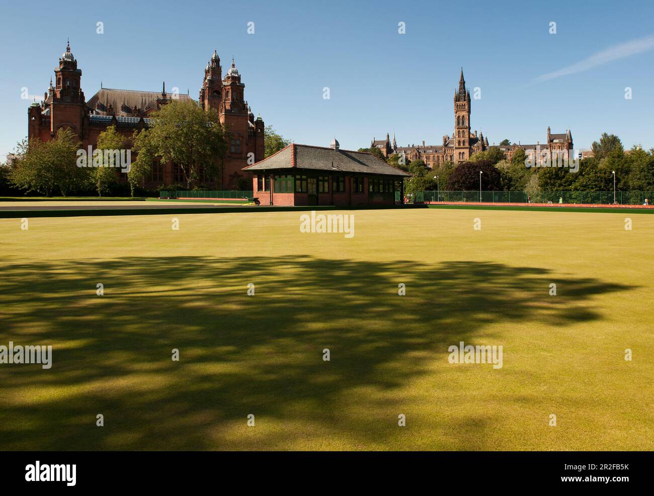 The pavilion of Kelvingrove lawn bowling green in front of Kelvingrove Art Gallery and Museum and the University of Glasgow in Glasgow, Scotland, UK Stock Photo