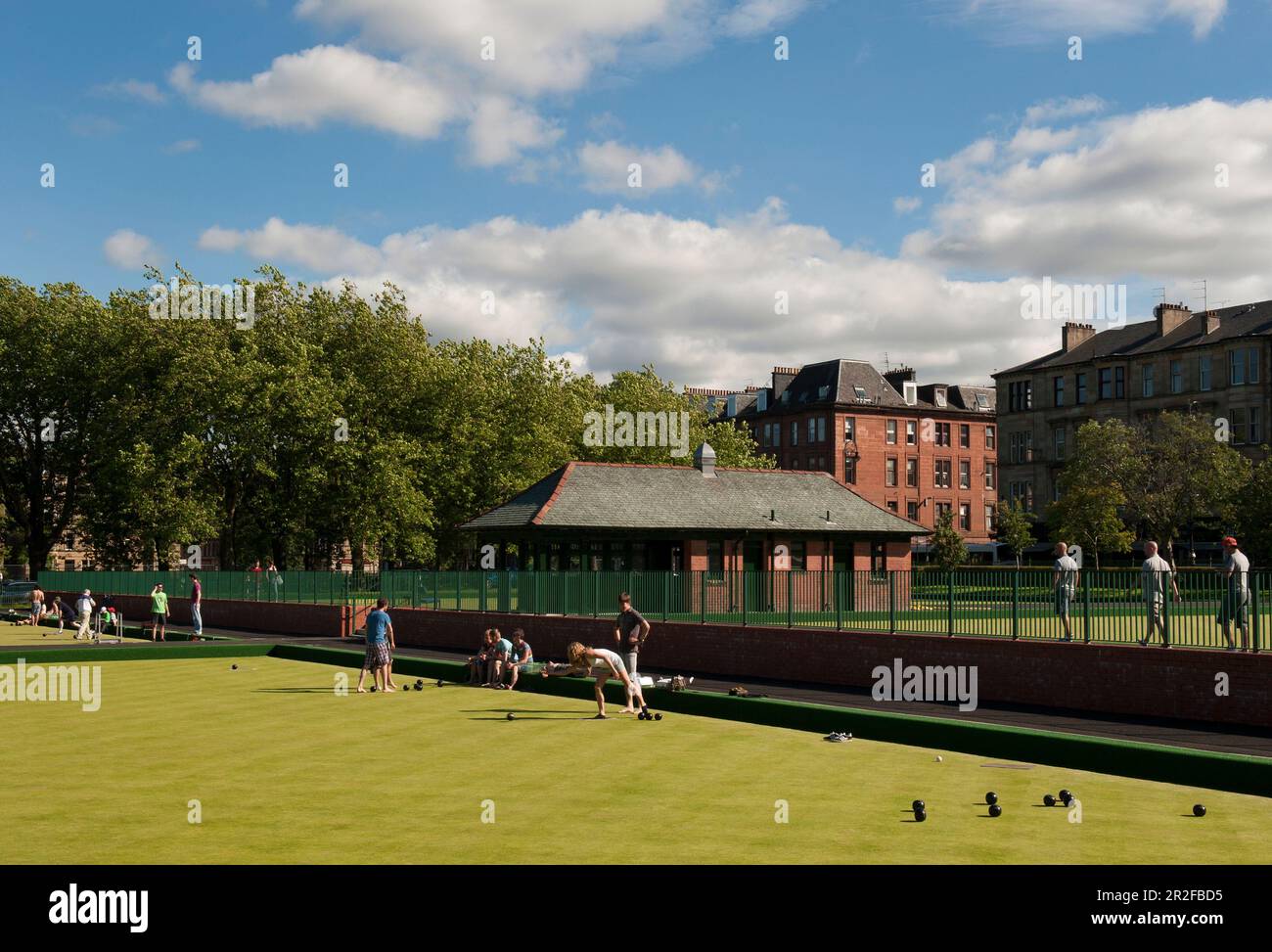 Bowls in play in front of the pavilion at the Kelvingrove lawn bowling green in Glasgow, Scotland, UK Stock Photo