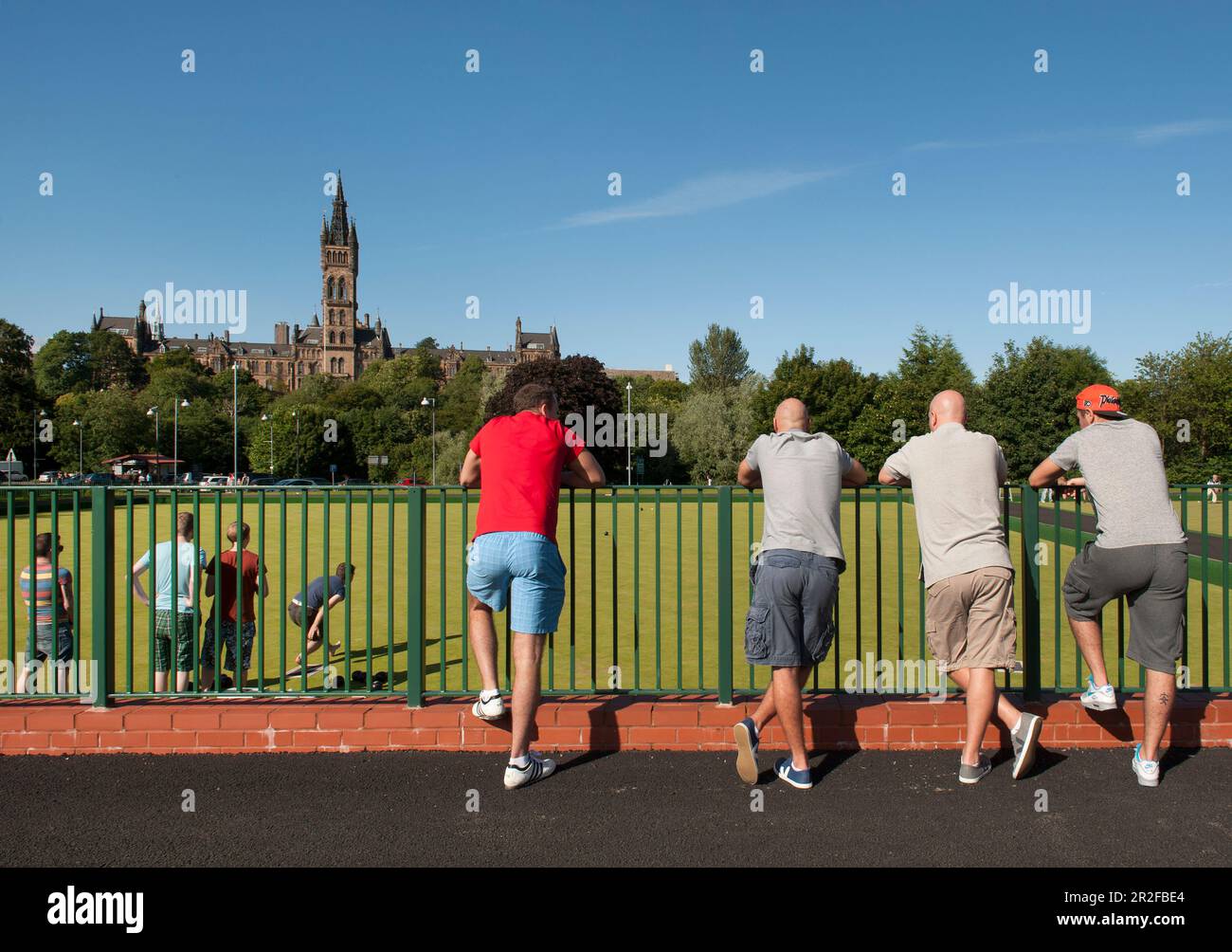 A crowd watches bowls in play on a hot day at the Kelvingrove lawn bowling green in Glasgow, Scotland, UK Stock Photo