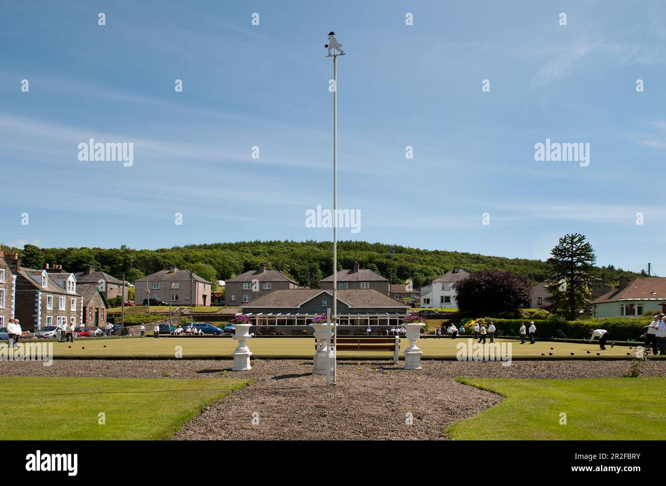 A very high metal sign depicting a bowler in front of bowls in play at Kirkcudbright lawn bowling green within the town of Kirkcudbright in Dumfries a Stock Photo