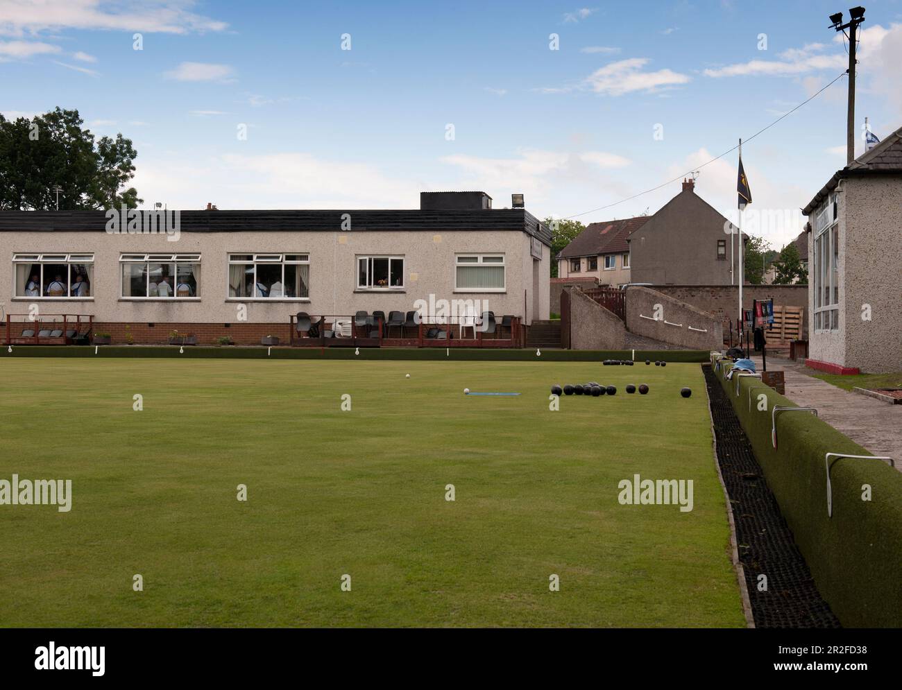 Bowling balls and mat infront of the club house at the Mauchline lawn bowling green in Mauchline; Ayrshire, Scotland, UK Stock Photo