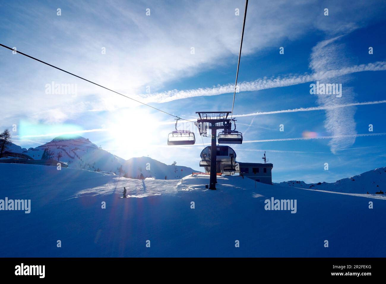 In the ski area Zauchensee, Sportwelt Amadé, mountains, chair lift, clouds, sky, ski slope, winter in Salzburg, Austria Stock Photo