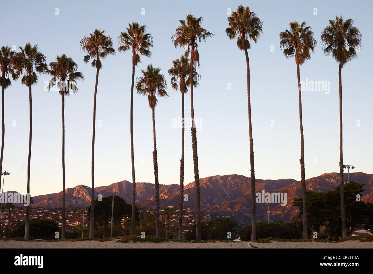 Boardwalk in the evening light with a view of the Santa Ynez Mountains in Santa Barbara, California, USA. Stock Photo