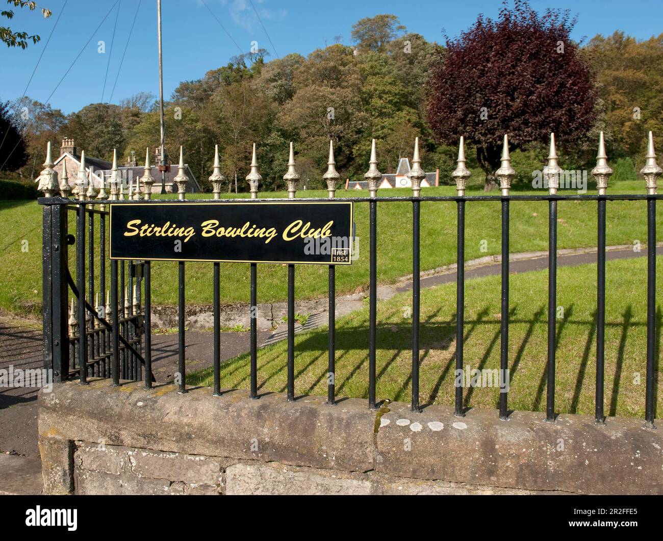 The iron gate and fence bearing a sign for the Stirling lawn bowling club green in Stirling, Scotland, UK Stock Photo