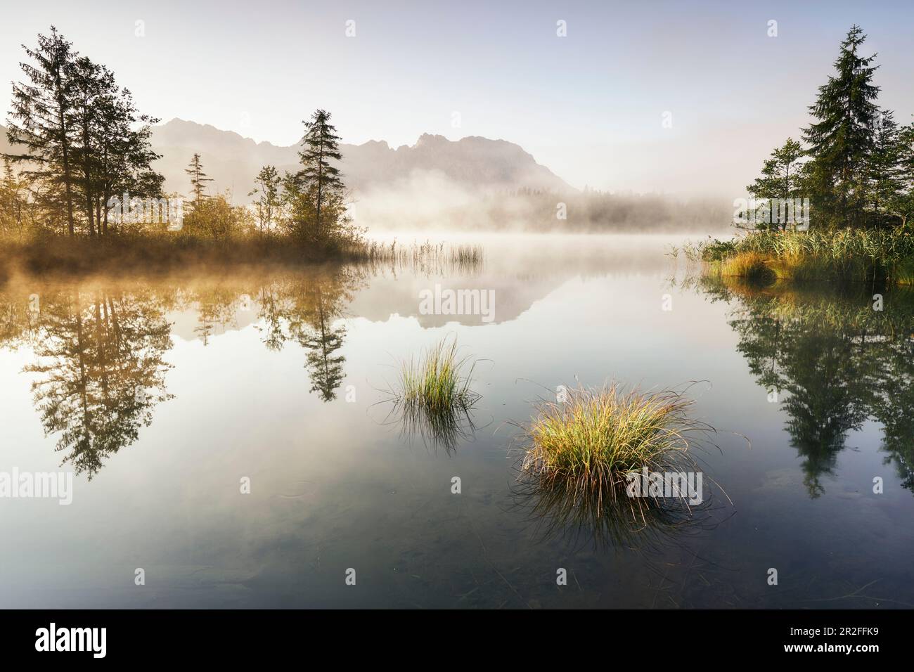 Sunrise at the Barmsee with a view towards the Karwendel massif ...