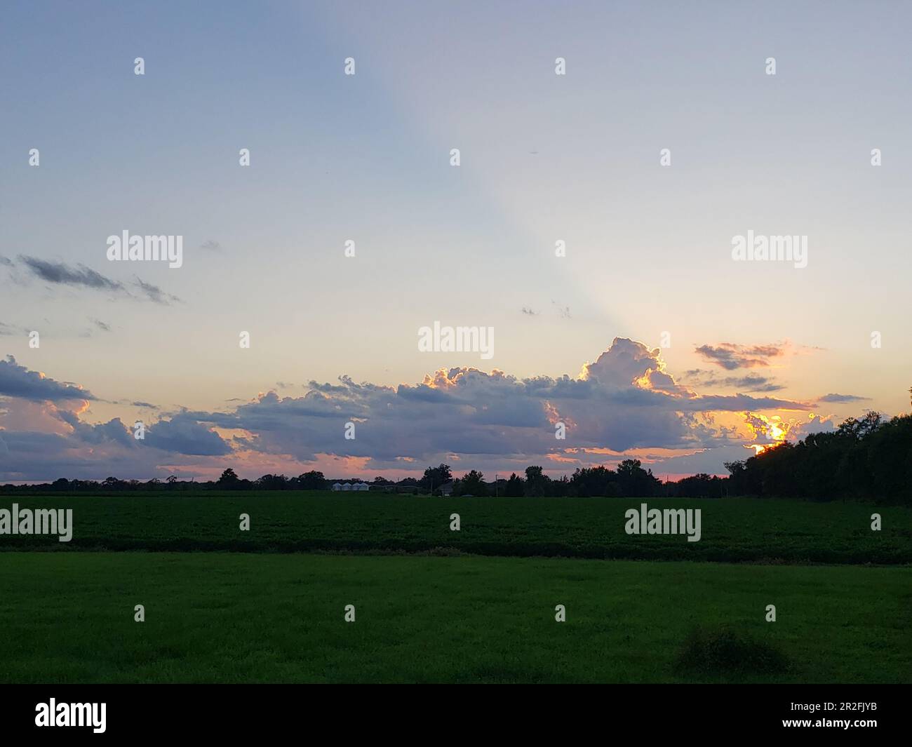 Farm land open field big sky dusk clouds and sun Bratt FL Escambia