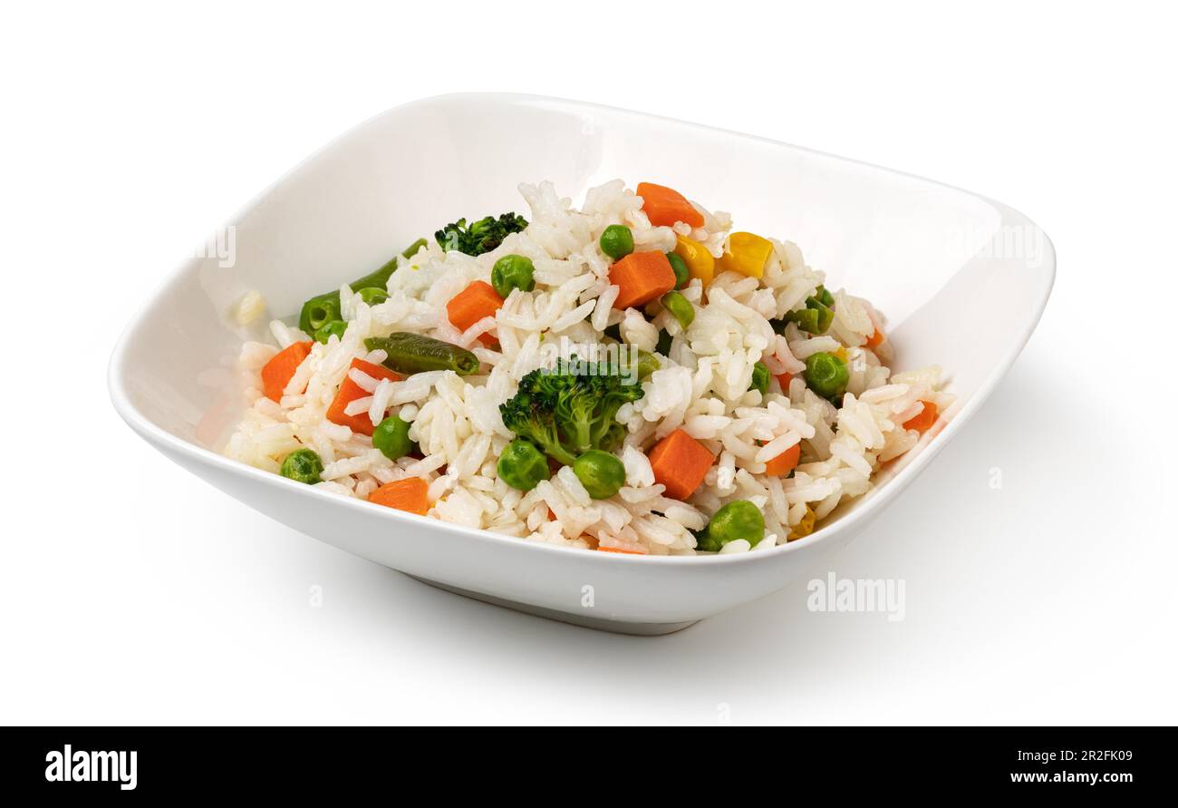 Bowl with tasty rice and vegetables. isolated on white background Stock Photo