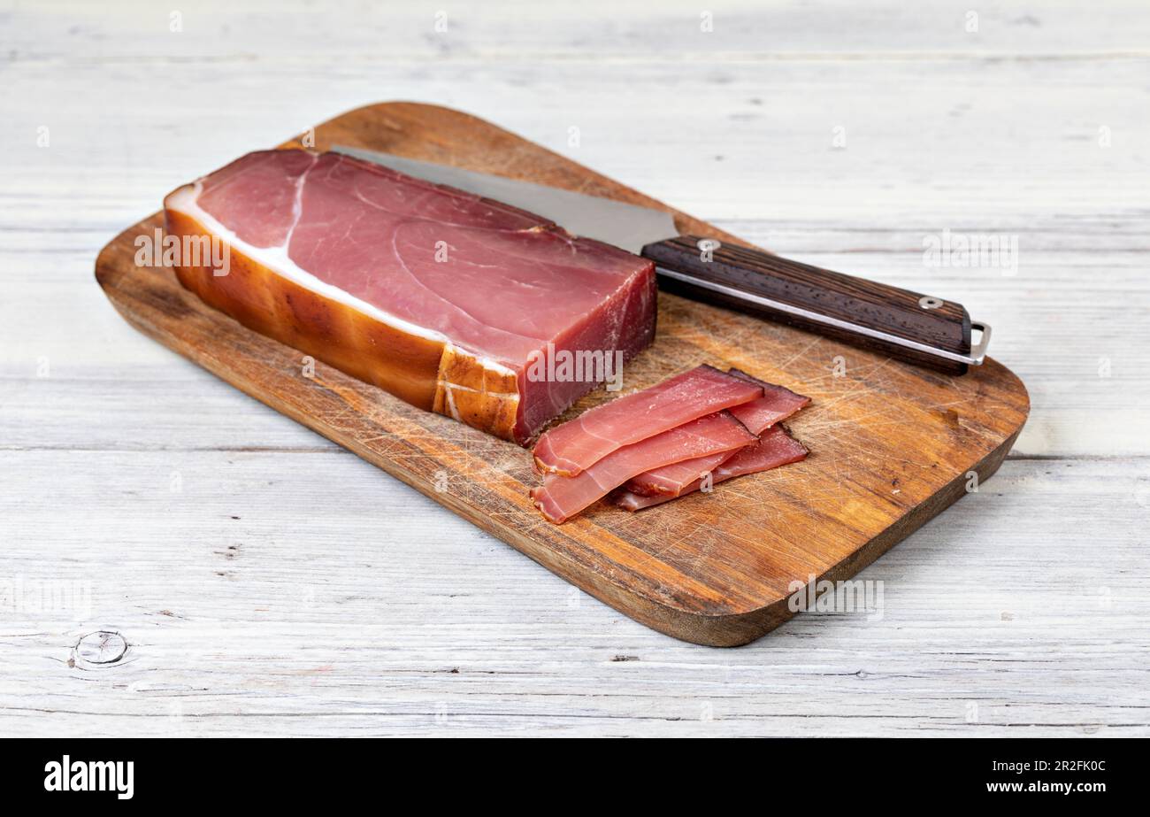 Italian prosciutto on a white background Stock Photo - Alamy