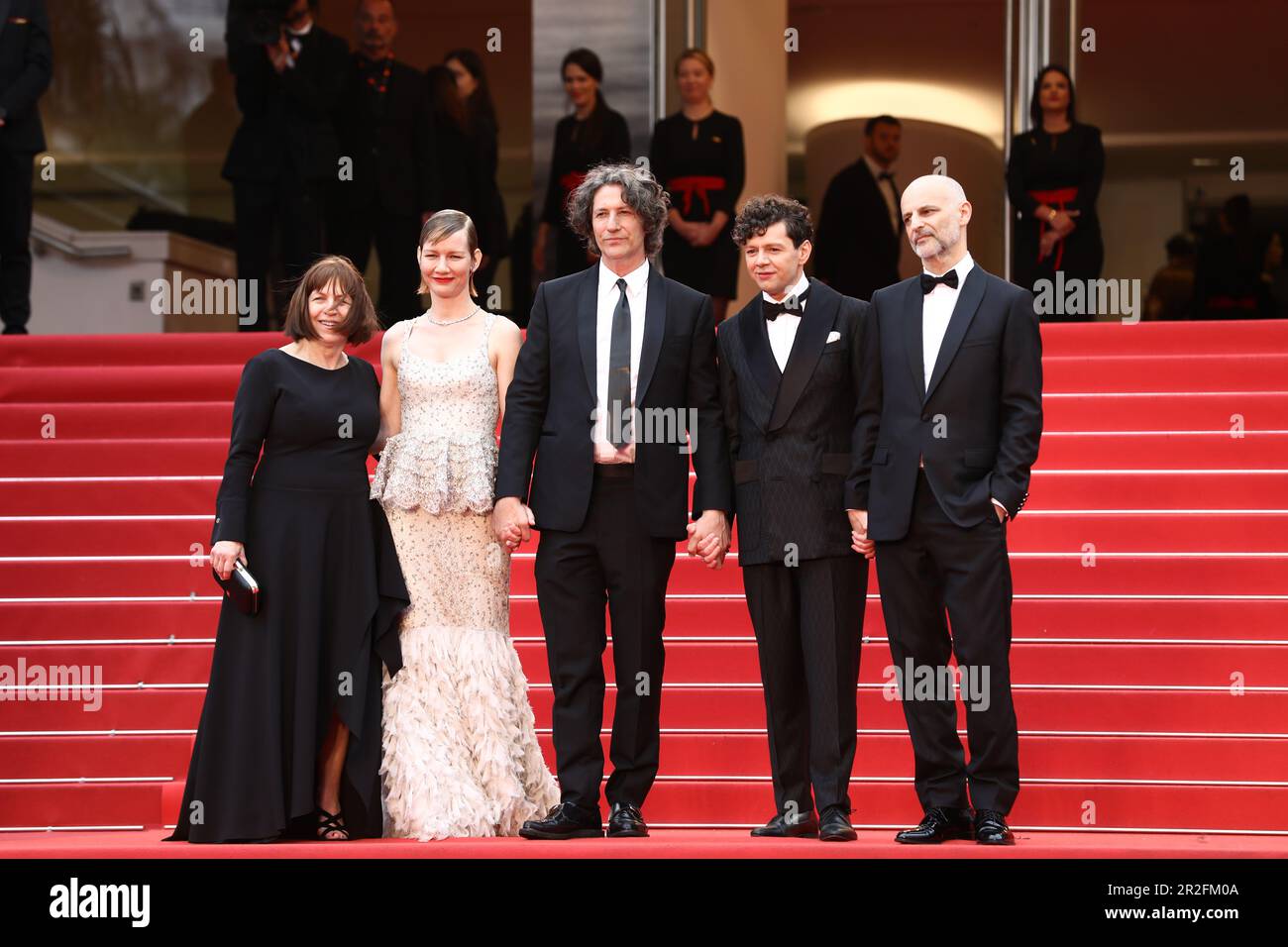 May 19, 2023, Cannes, Cote d'Azur, France: Cast and crew members including producer EWA PUSZCZYNSKA, german actress SANDRA HÃœLLER, director JONATHAN GLAZER, german actor CHRISTIAN FRIEDEL and producer JIM WILSON attend the screening of 'The Zone of Interest' during the 76th Annual Cannes Film Festival at Palais des Festivals on May 19, 2023 in Cannes, France (Credit Image: © Mickael Chavet/ZUMA Press Wire) EDITORIAL USAGE ONLY! Not for Commercial USAGE! Stock Photo