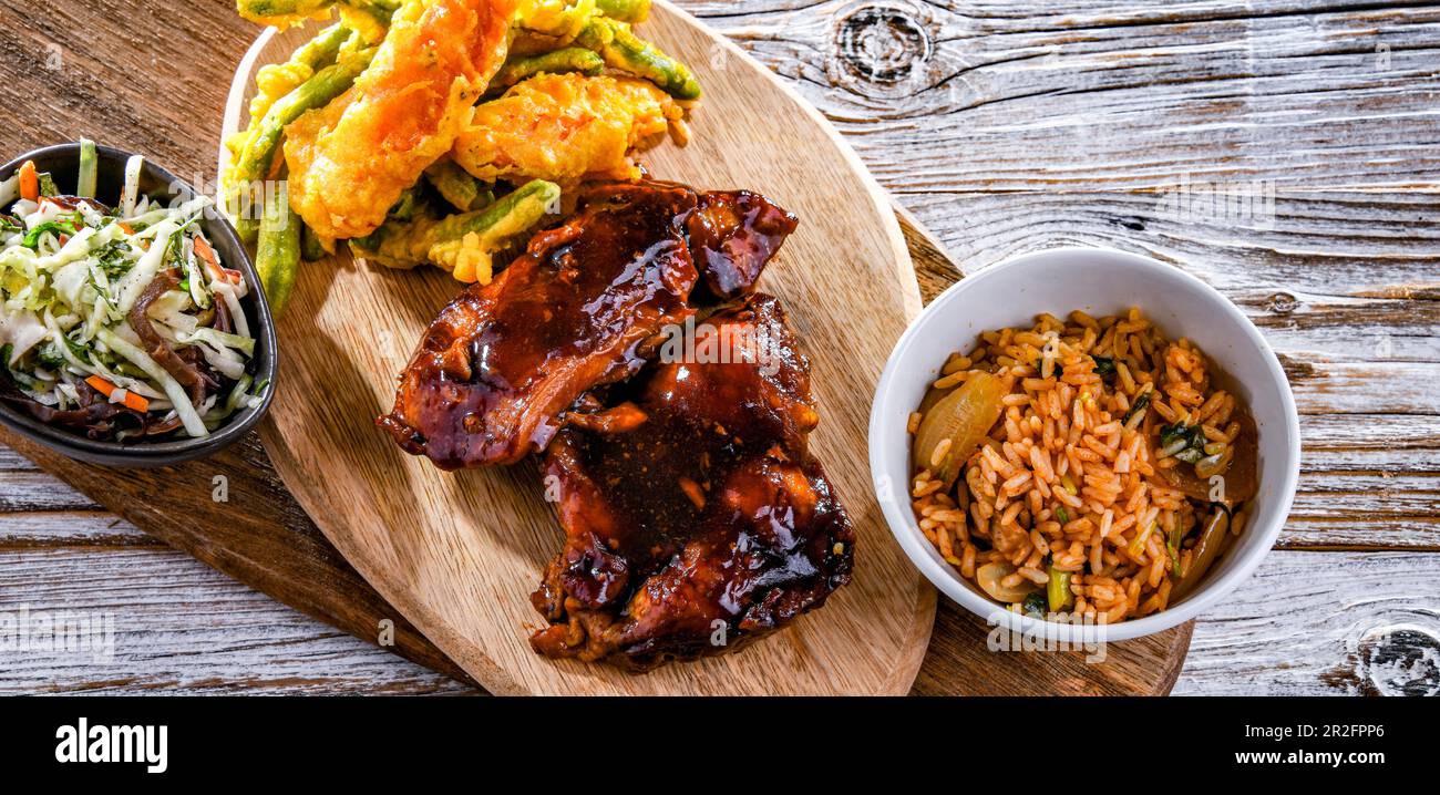 Chicken thighs in tamarind sauce with tom yum wok fried rice and