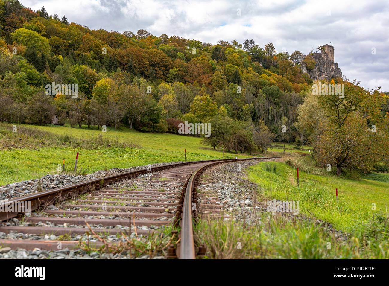 Railway track below the Neideck ruin in autumn, Streitberg, Upper Franconia, Bavaria, Germany Stock Photo