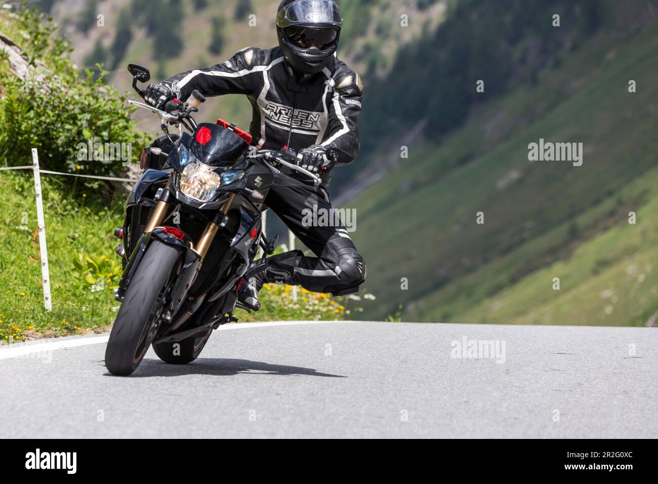 Motorbike on the winding Nufenen Pass in the Alps, popular motorbike route, Ulrichen, Obergoms, Canton Valais, Switzerland Stock Photo