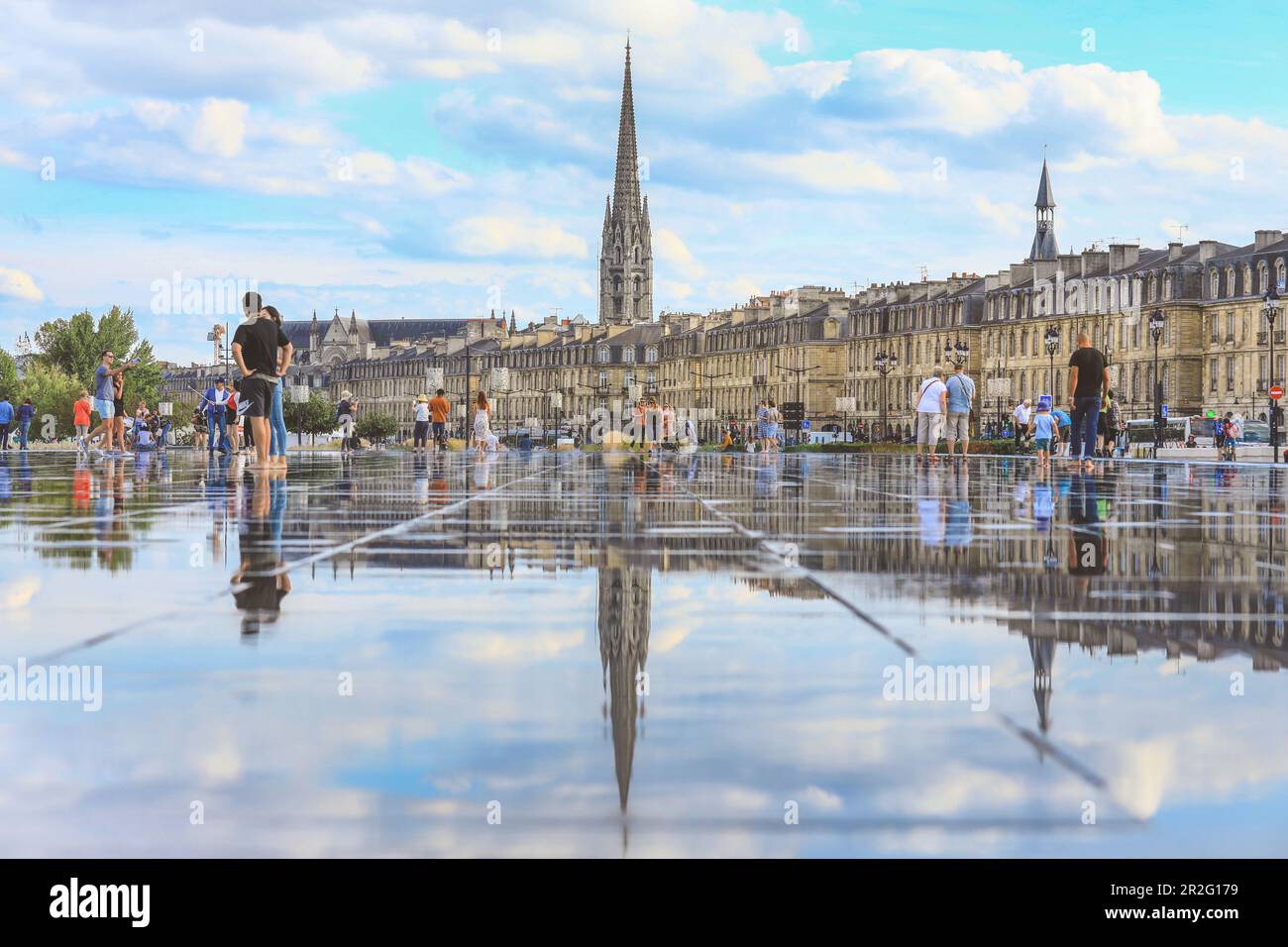 BORDEAUX, FRANCE - 13 September, 2018 : Selective focus on tourists standing on Bordeaux water mirror, it's always full of people in a hotest summer d Stock Photo