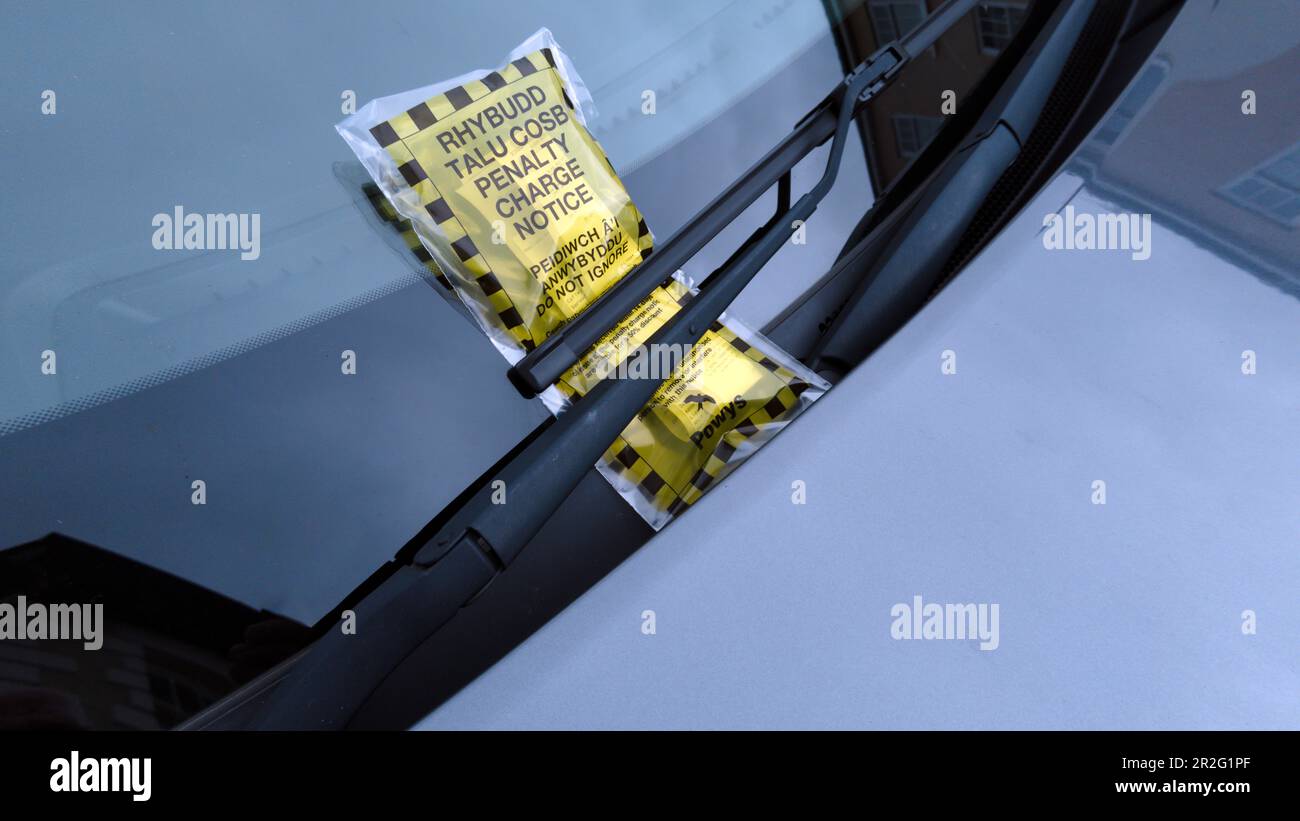 Bilingual penalty charge ticket for illegal car parking in the Wales UK. Stock Photo