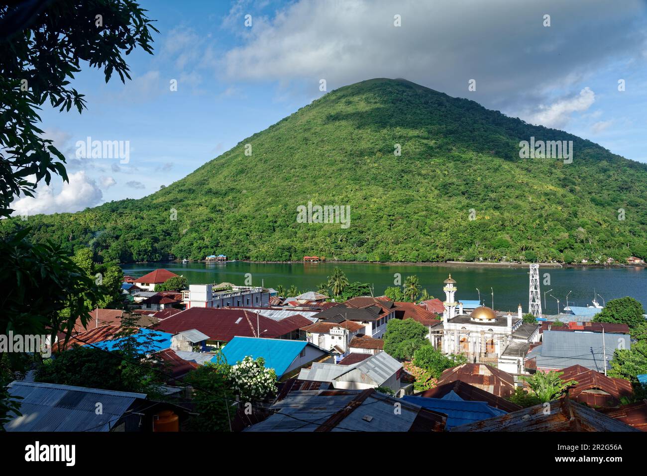 Above the roofs of Banda Neira, across from the island of Banda Api ...