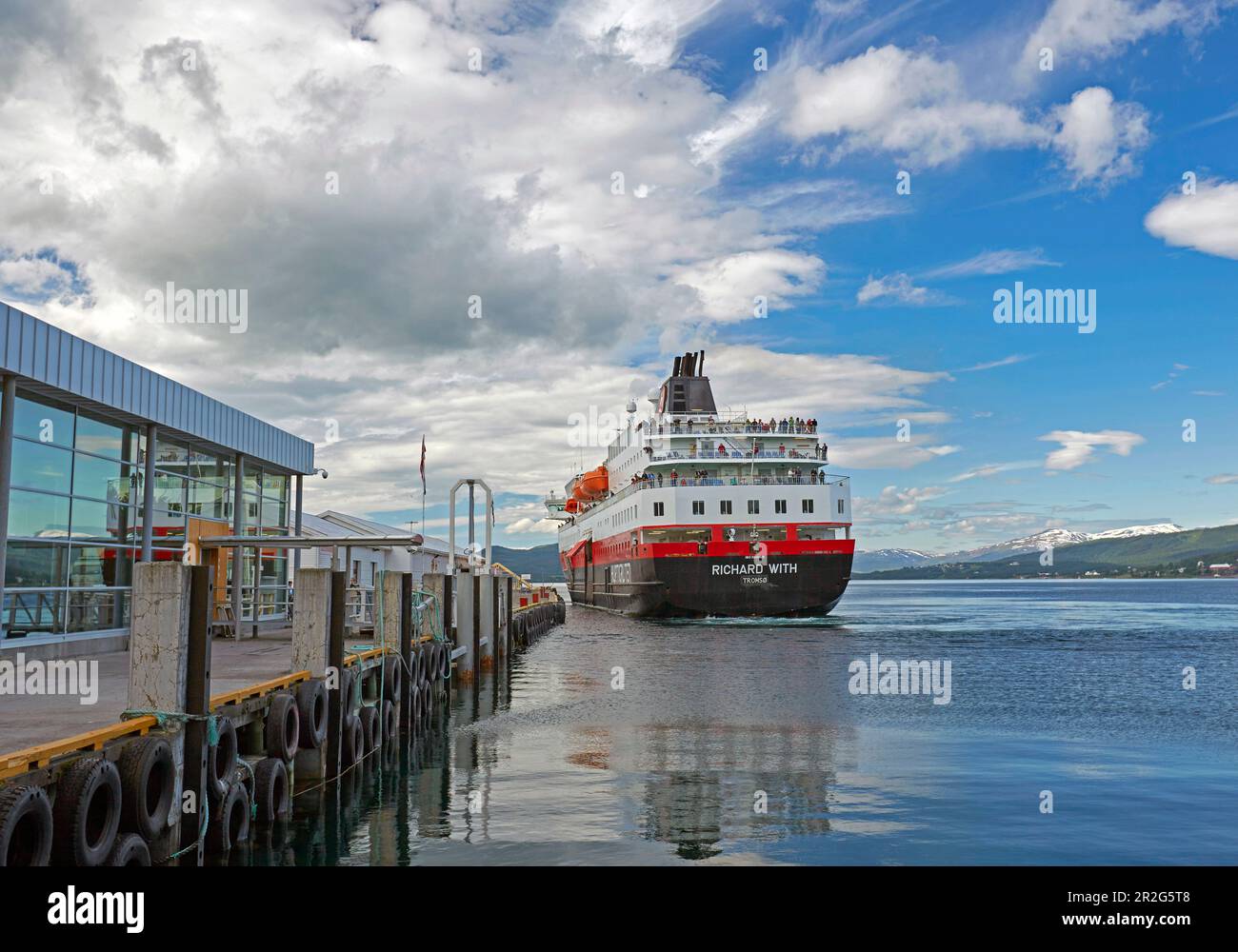 Hurtigruten - ship in Finnsnes on Gisundet, Senja island, Troms, Norway, Europe Stock Photo