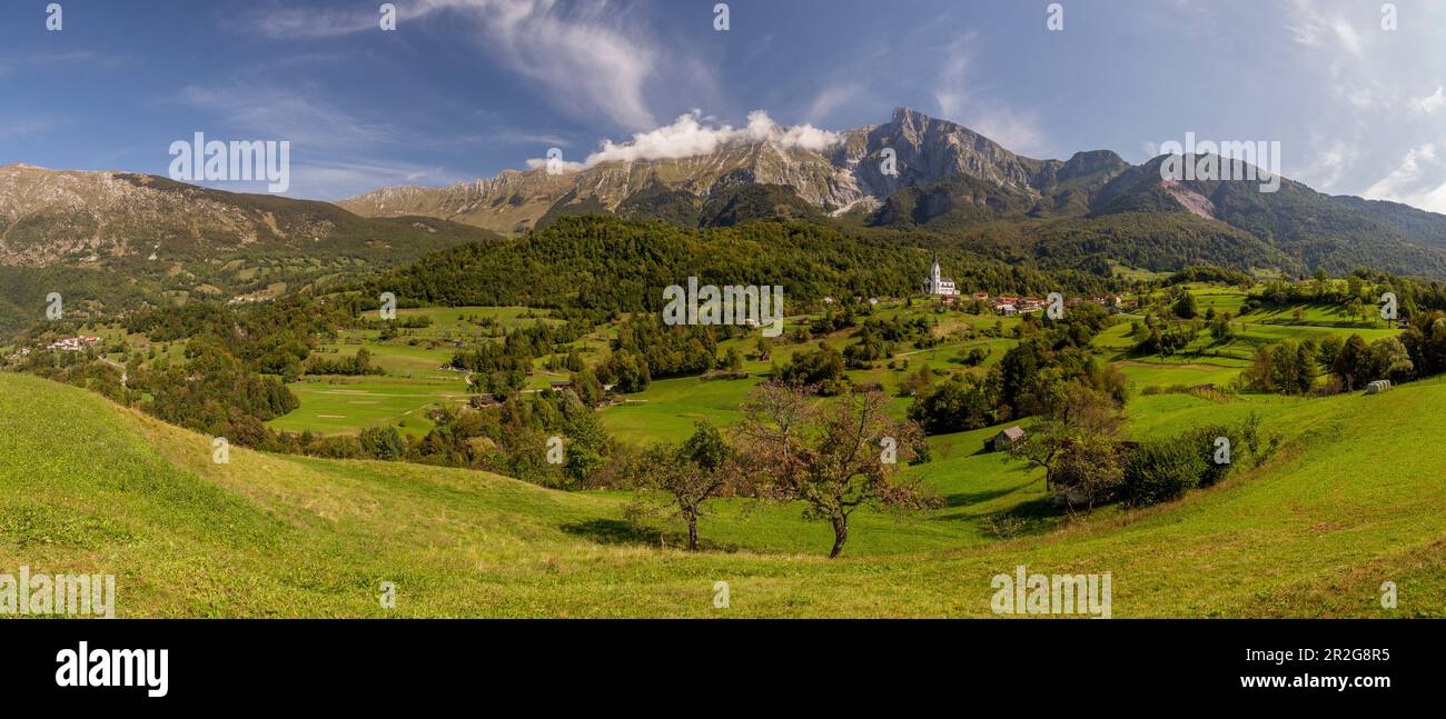 Panoramic view of Dreznica village in summer landscape, background Krn mountain, Kobarid, Slovenia. Stock Photo