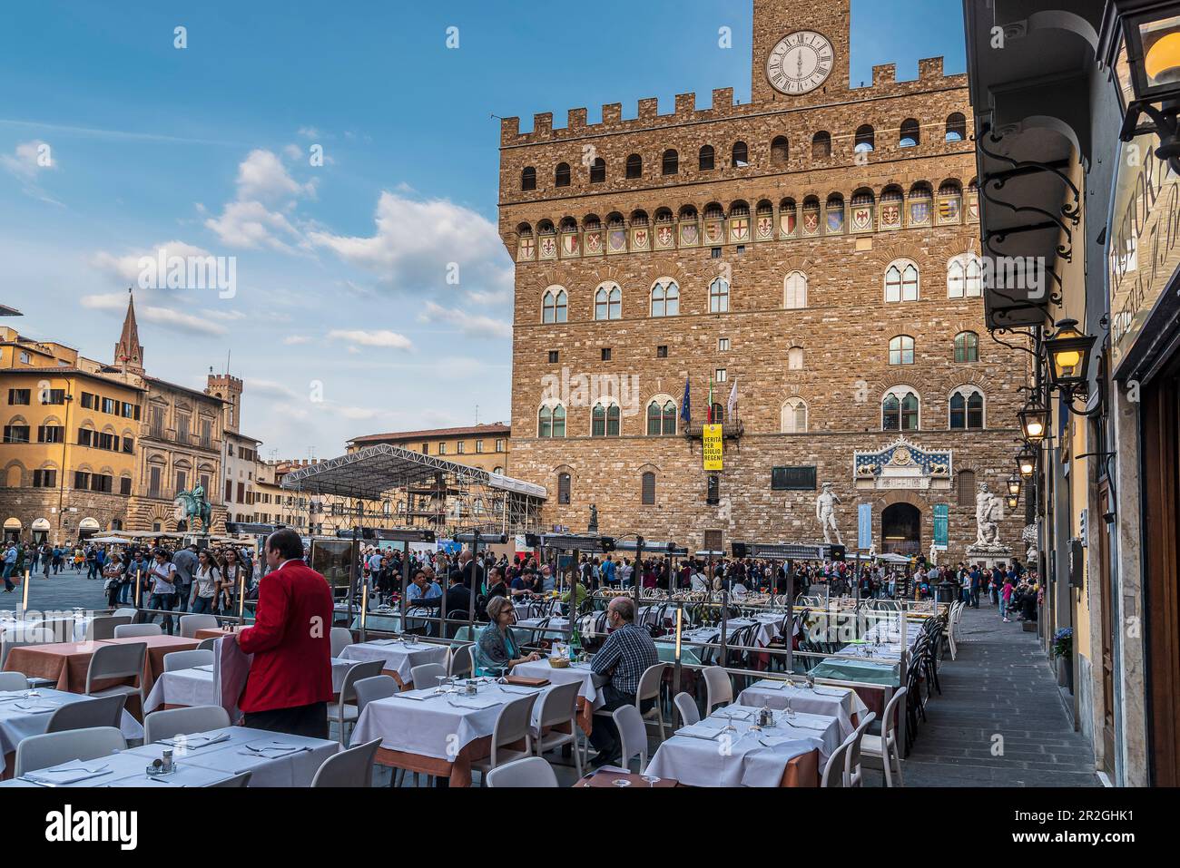 People at a restaurant in front of the Palazzo Vecchio town hall, Piazza della Signoria, Florence, Tuscany, Italy, Europe Stock Photo