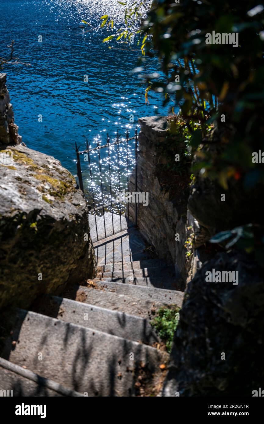 Metal Gate on the Waterfront with Sun Reflection in Lugano, Ticino, Switzerland. Stock Photo