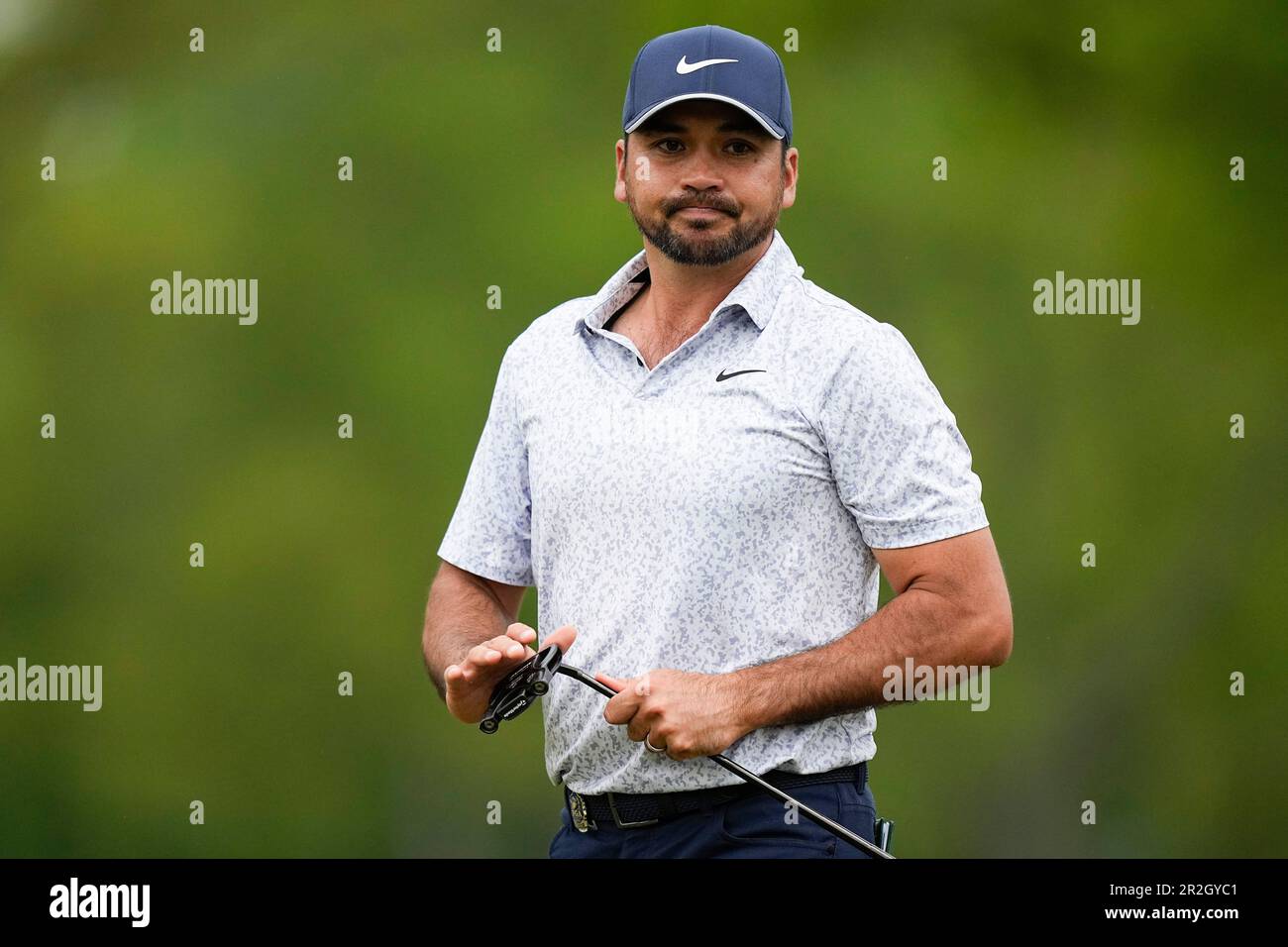 Jason Day, of Australia, reacts after missing a putt on the fourth hole