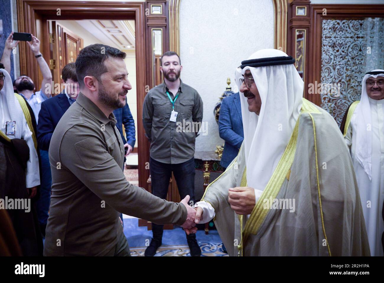 Jeddah, Saudi Arabia. 19th May, 2023. Ukrainian President Volodymyr Zelenskyy, left, greets Kuwait Crown Prince Mishal Al-Ahmad Al-Jaber Al-Sabah, right, before their bilateral meeting on the sidelines of the Arab League Summit, May 19, 2023 in Jeddah, Saudi Arabia. Zelenskyy attended the annual summit meeting as part of a broader pitch for global support against the Russia invasion of Ukraine. Credit: Pool Photo/Ukrainian Presidential Press Office/Alamy Live News Stock Photo