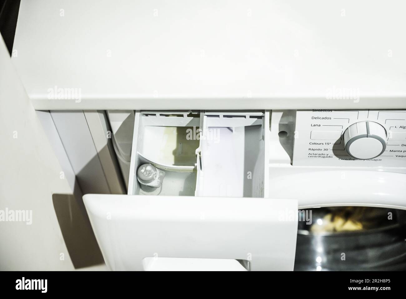 A cubicle for the dosing of soap, bleach and fabric softeners for