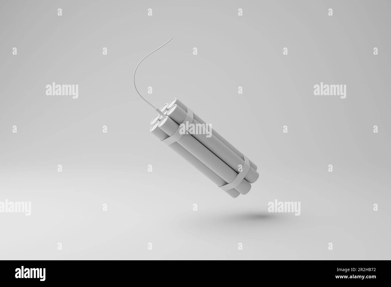 Bundle of dynamite sticks floating in mid air with shadow on white background in monochrome. The concept of explosion, terrorism and violence Stock Photo