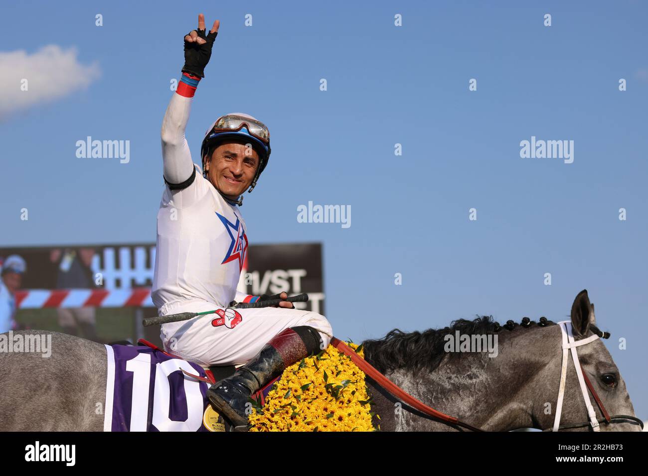 Rafael Bejarano, atop Taxed, reacts after winning the 98th running of