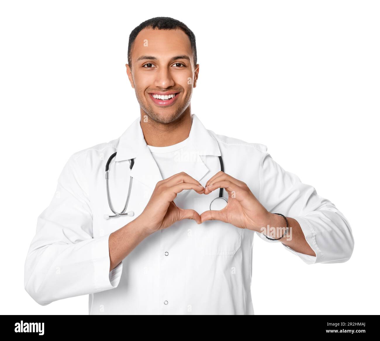 Doctor or medical assistant (male nurse) making heart with hands on ...