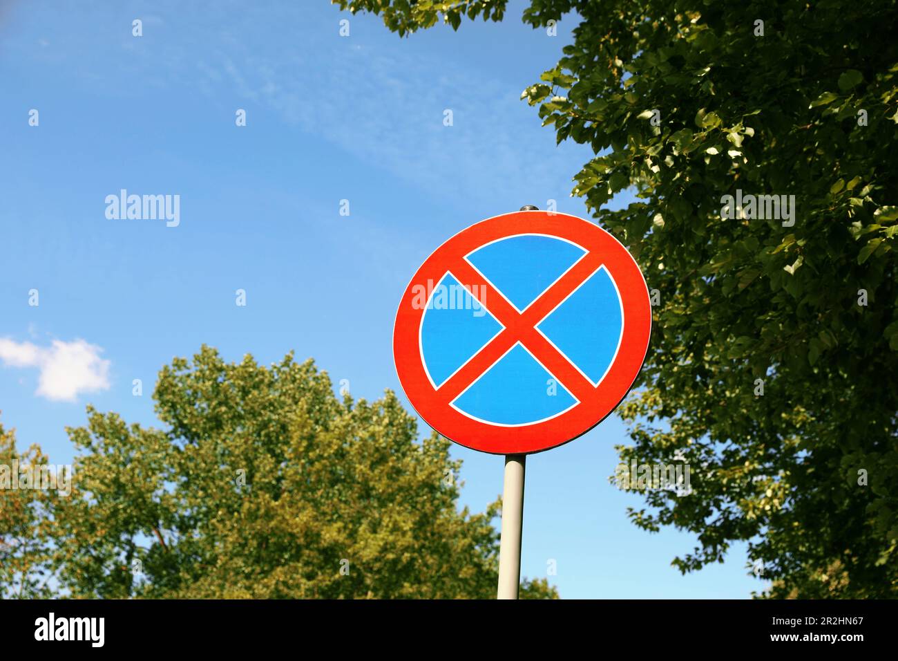 Road sign No Stopping against blue sky. Space for text Stock Photo - Alamy