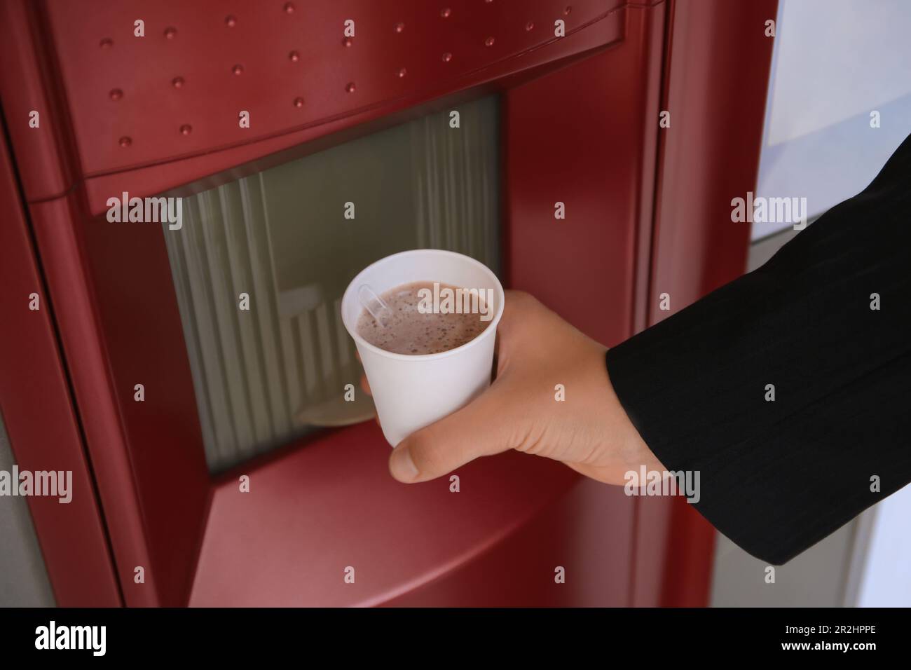 Woman taking paper cup with coffee from vending machine, closeup Stock ...