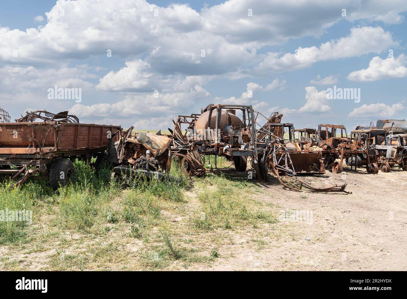 View of the destructions of agricultural equipment of Farm Pershe Travnia of village Velyka Oleksandrivka of Kherson region seen after liberation from Russian invasion. The farm was producing grain (wheat, barley, sunflower), meat (pork), and other products; with 100 employees and more than 3,000 hectares of fields, more than 1200 pigs. The farm was completely destroyed, all equipment, harvest from 2021, fertilizer, all buildings including storages for grain and places where pigs were kept and fed. After bombing pigs were either burned alive, some in panic jumped into the well. Serhiy Kosyuk e Stock Photo