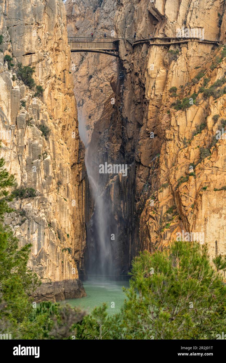 Suspension bridge and waterfall of the Caminito del Rey via ferrata near El Chorro, Andalusia, Spain Stock Photo