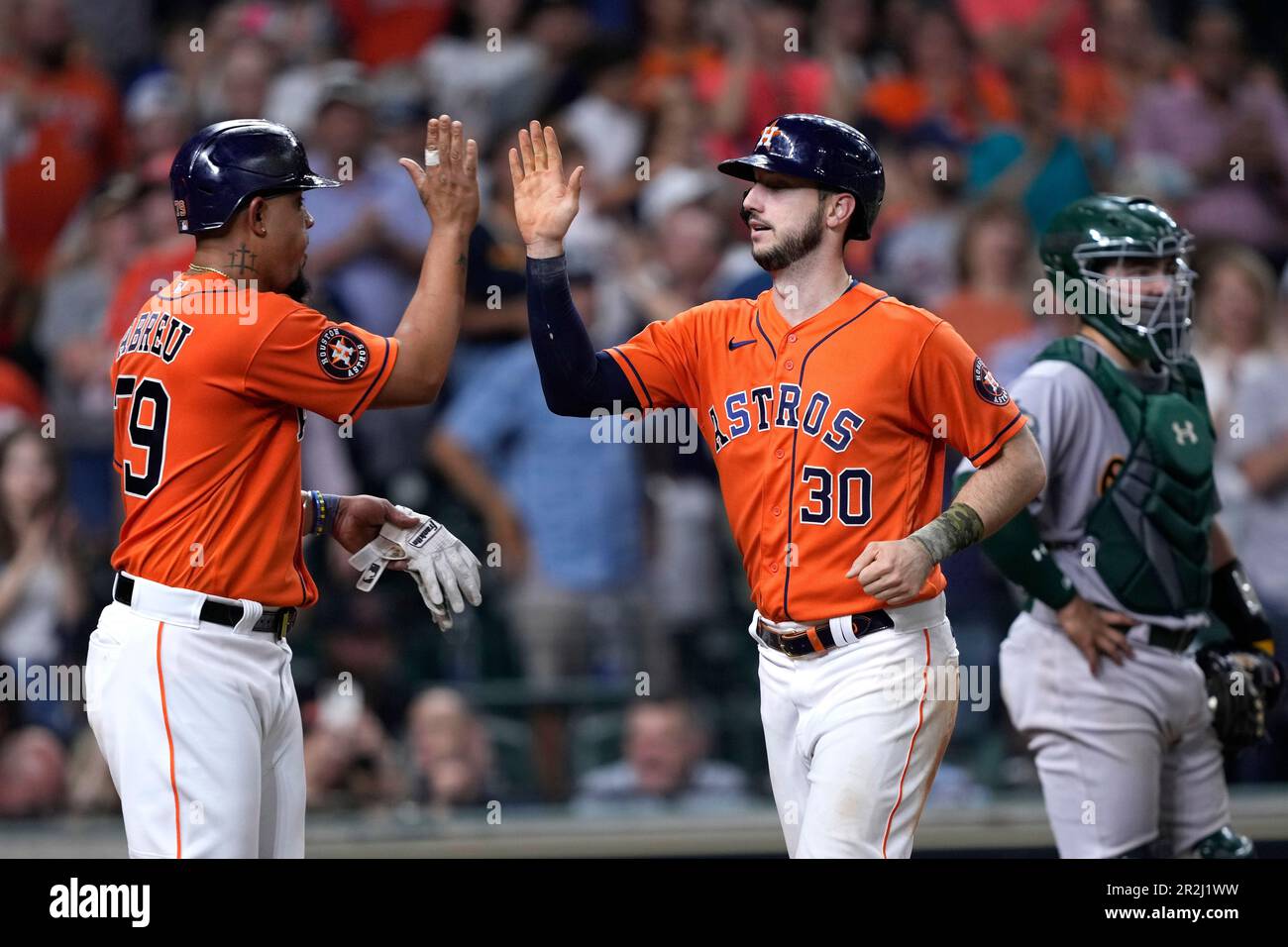 New York Yankees catcher Kyle Higashioka, right, looks on as Houston  Astros' Kyle Tucker (30), second from right, Jeremy Pena, second from left,  greet Jake Meyers after he hit a three-run homer