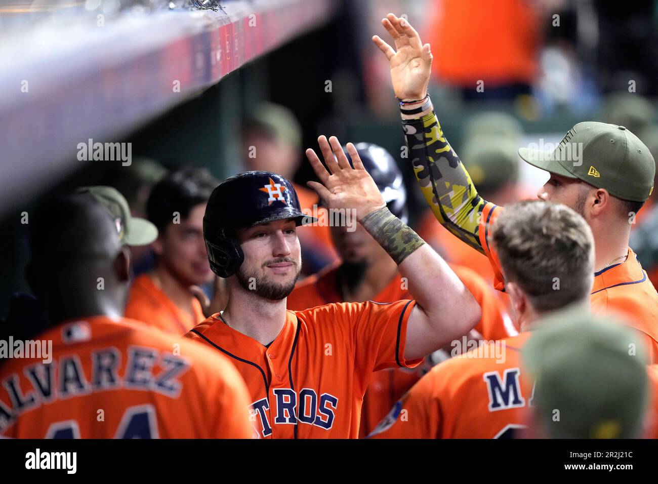 Houston Astros' Kyle Tucker celebrates in the dugout after hitting a